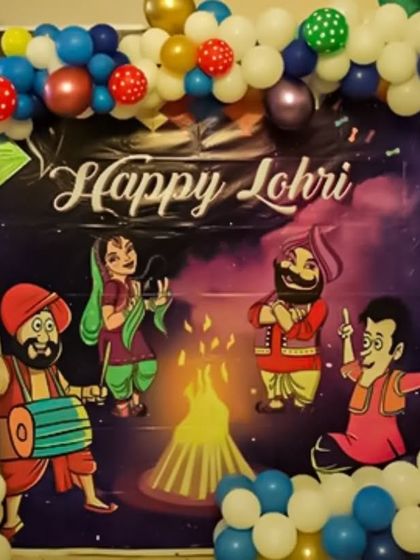 For a vibrant Lohri celebration, I used a custom-printed backdrop with traditional Punjabi folk characters. The scene is framed by a multi-colored balloon arch that adds to the festive and joyful atmosphere of the event.