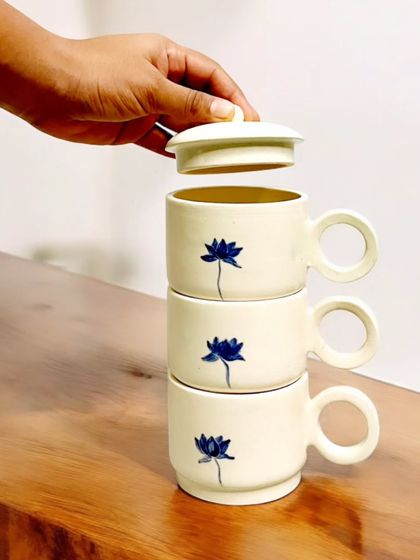 These stackable, hand-painted ceramic cups with a delicate blue lotus motif are perfect for sharing a cup of tea. I am currently accepting pre-orders for these unique sets.
