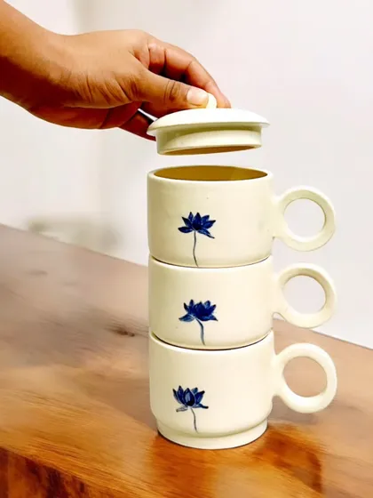 These stackable mugs feature a delicate, hand-painted blue lotus design. Their space-saving functionality makes them as practical as they are beautiful, and I am currently accepting pre-orders for this set.