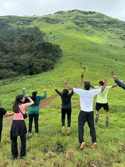 A fun, coordinated jump by a group on the green slopes of Gangadikal.