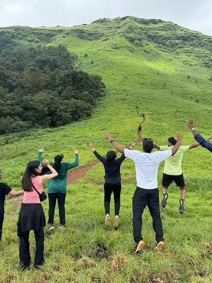 A fun, coordinated jump by a group on the green slopes of Gangadikal.