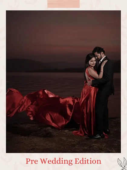 A moody and romantic pre-wedding shot by the water. The deep red of the gown adds a touch of passion and elegance, perfectly complementing the groom's dark suit.