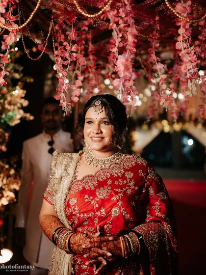 The bride's entrance, looking radiant under the floral decorations.