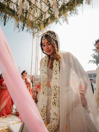 An emotional moment during the Pheras, as the bride looks down with a tear in her eye, capturing the profound feelings of the day.