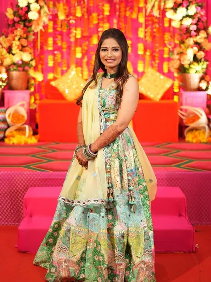 Each detail, from the colors to the embellishments, reflects a rich tapestry of culture and modern glam for this Mehendi look.