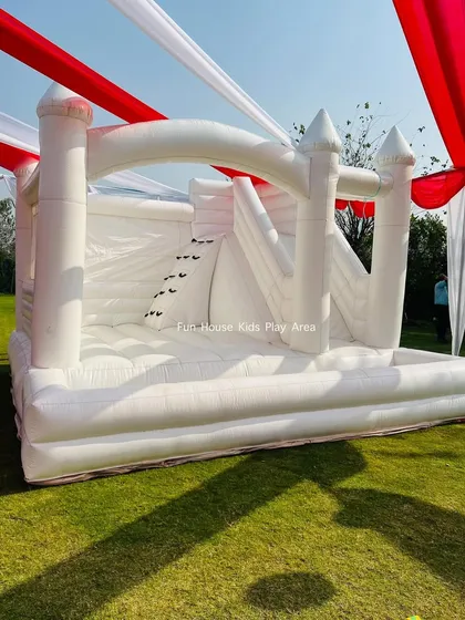 Another angle of the white castle under the big top, ready for bouncing fun.