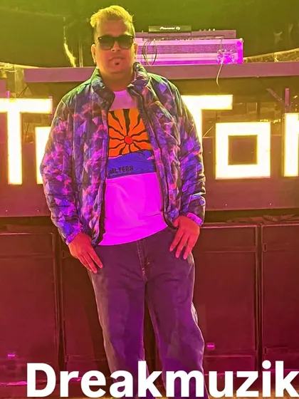 Posing for a quick photo in front of the iconic TomTom sign after a great set. I love the energy of this venue.