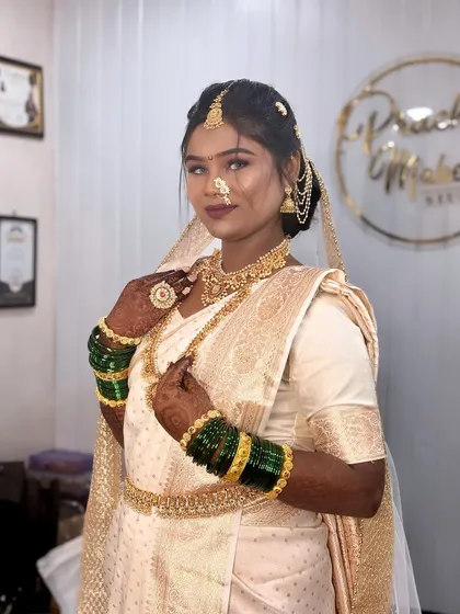 Another shot of the Buddhist bride, showing her serene expression and the intricate details of her jewellery.
