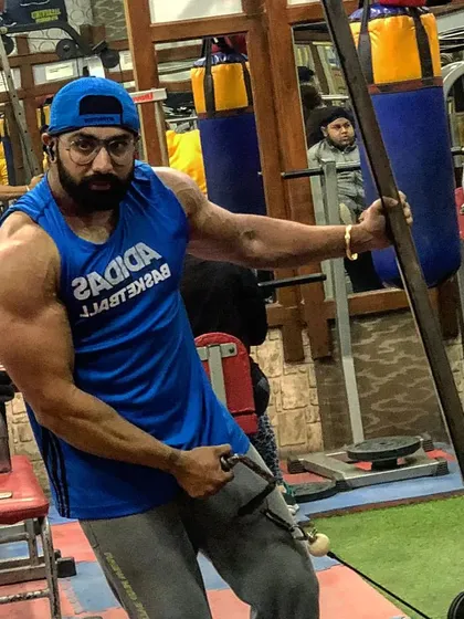 A candid shot during a tricep workout. Building impressive arms requires hitting all three heads of the tricep with intensity and proper form.