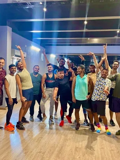 A fun group pose after a successful corporate dance fitness session. The studio provides a refreshing and offbeat venue for team-building and wellness activities.
