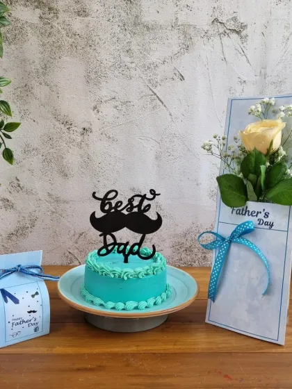 The ultimate Father's Day combo: a "Best Dad" mini cake, a single rose, and a box of treats.