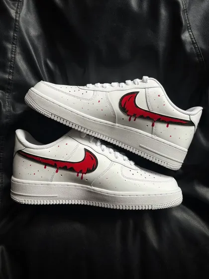 A top-down view of the red drip custom sneakers.