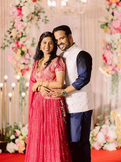 A classic portrait of the happy couple, Melvin and Marilyn. The soft, romantic floral backdrop with pastel roses and hanging chandeliers provided the perfect setting for their reception photos.