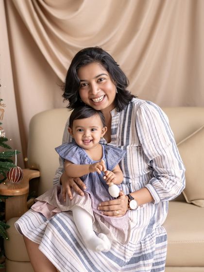 Happiness is seeing these smiles. A mother and daughter share a joyful moment together.