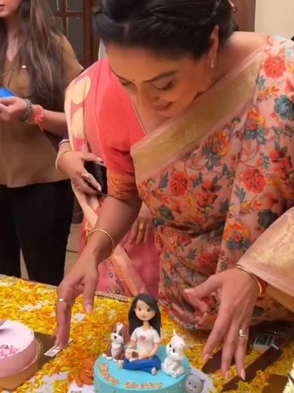 Rupali Ganguly cutting the fur baby-themed cake we made for her birthday. So much joy in one picture!