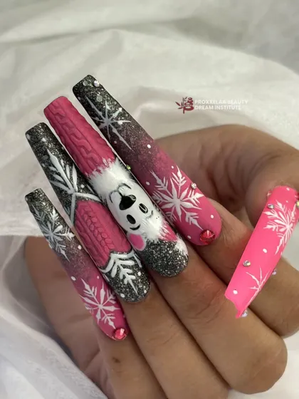Another angle of the pink and black winter nail set, highlighting the glitter accents and the hand-painted snowflake details.
