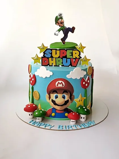 A Super Dhruv cake! This Mario Bros. theme cake features Mario and Luigi in their classic world, complete with mushrooms, coins, and stars.