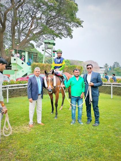 Chinky Pinky, winner of The Good-Bye Cup, with jockey P. Trevor and the winning team.