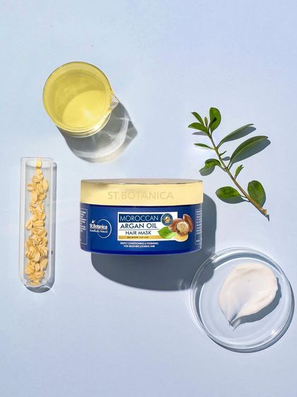 This flatlay deconstructs the product's formula. We placed the hair mask alongside its key ingredients in lab glassware, creating a shot that feels both clean, scientific, and trustworthy.