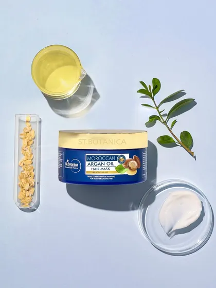 This flatlay deconstructs the product's formula. We placed the hair mask alongside its key ingredients in lab glassware, creating a shot that feels both clean, scientific, and trustworthy.