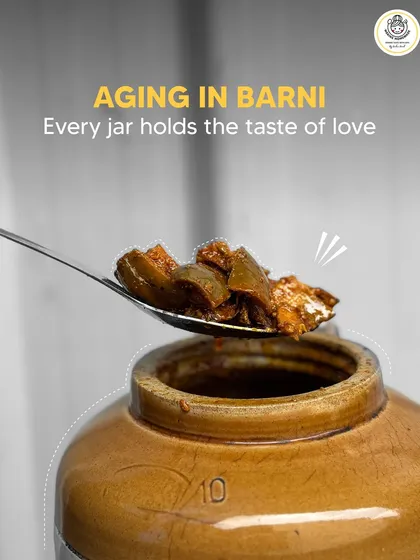 After mixing, the pickle is left to age in a traditional barni. This is where the magic happens, as the flavors mature and deepen over time, creating a taste that is truly special.