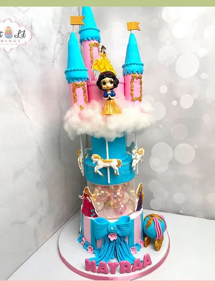 We bring fairy tales to life with this magnificent multi-tiered princess castle cake, complete with a rotating carousel. Featuring beloved princesses and intricate details, this is the kind of magical centerpiece that makes a child's birthday dream come true.