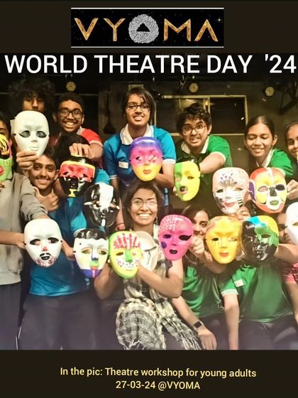 Students from a theatre workshop for young adults proudly display the masks they've created and painted. Mask work is a fantastic tool for exploring character and transformation.