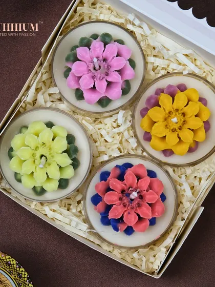A set of four succulent-style tea light candles, perfect for the plant lover in your life.