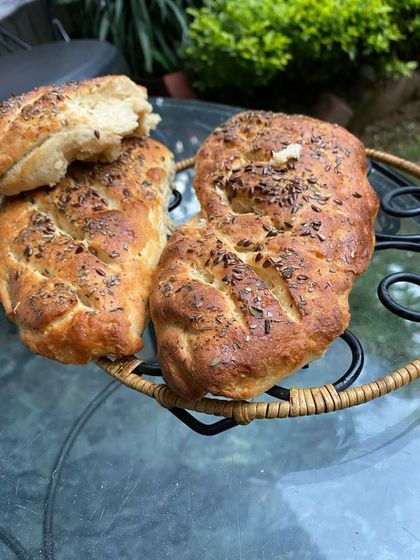 Freshly baked, rustic bread topped with savory seeds. We believe in making everything from scratch where possible, and our artisanal breads are a testament to that.