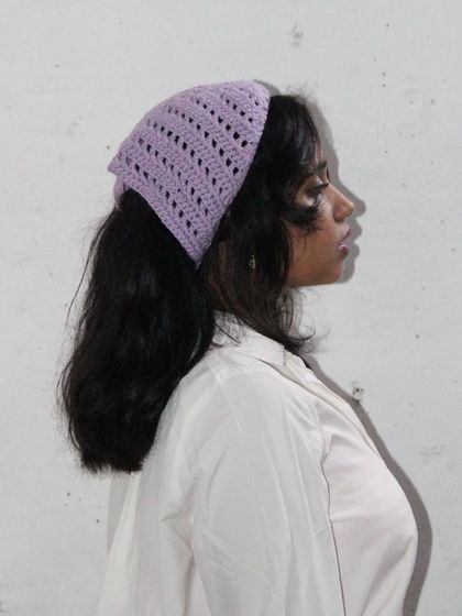 A side profile showing how the crochet bandana sits on the hair. It’s a lightweight and breathable accessory, perfect for keeping your hair back in style.