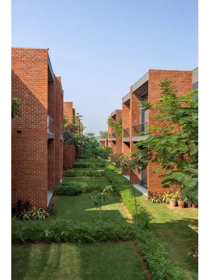 The residential blocks are separated by landscaped green corridors, providing residents with pleasant views and spaces for social interaction.