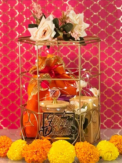 I believe a gift should be an experience. This regal gold cage hamper, filled with gourmet treats and aromatic essentials, is perfect for Diwali, weddings, or any grand celebration where you want to leave a lasting impression.