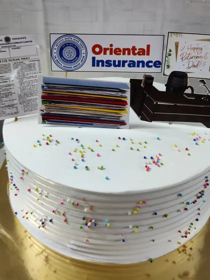 A retirement cake for a dad from Oriental Insurance. This custom cake features edible prints of his office desk, files, and company logo.