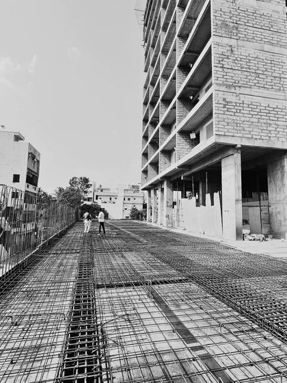 This on-site photograph shows the rebar framework for a new floor slab at the JP Nagar project. It is a glimpse into the critical engineering and structural work that forms the foundation of every building I design, a process where precision is paramount.