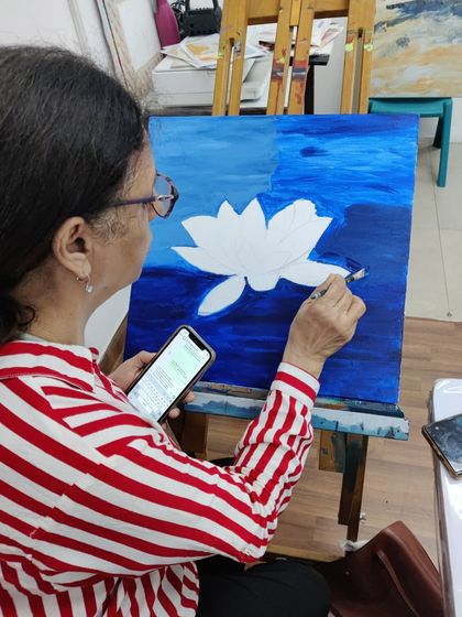 The journey of a lotus painting, from the first strokes of the background to the delicate shading on the petals.