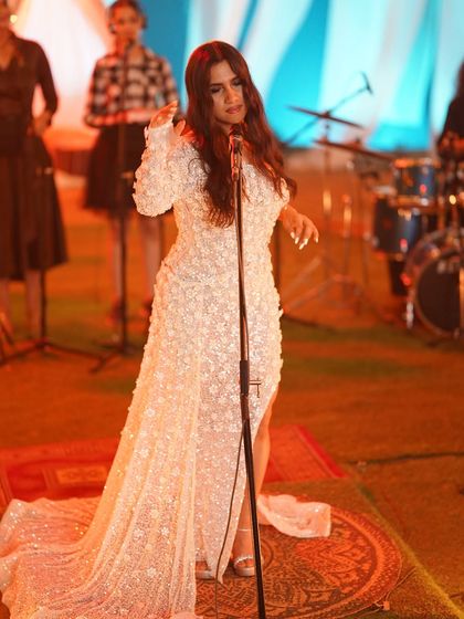 A full-length view of the beautiful Chisel by MR gown I styled for Nikhita Gandhi, complete with a dramatic train that added to the performance's visual appeal.