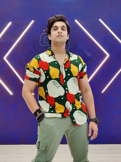 Another look in a colorful, quirky shirt. This shows my ability to carry bold patterns and stand out, perfect for brands with a unique sense of style.
