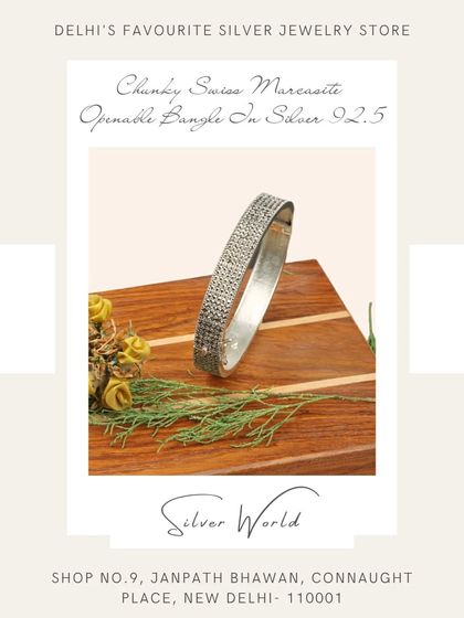 A chunky, openable bangle studded with Swiss marcasite. This wide bangle makes a bold, vintage-inspired statement.