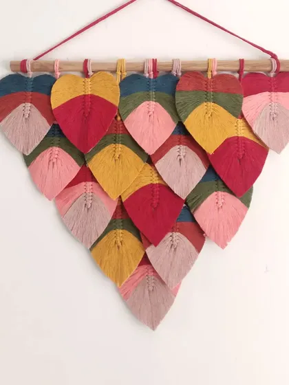 Pop your wall with this bold and vibrant macrame leaf hanging. Accent decor like this can instantly transform a room and change the vibe of your whole house.