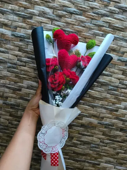 The full view of the Red Heart Rose Bouquet, showing how the black and white wrapping makes the red flowers and hearts pop.