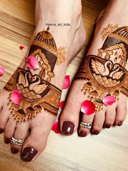 Your feet deserve beautiful art too. This design features a pair of graceful swans in a royal arch, surrounded by delicate patterns and scattered rose petals for a truly romantic feel.