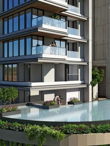 The podium-level pool at our luxury residential project in Khar. The design features an abundance of natural greenery blended with elegant wood finishes, creating a resort-like oasis for residents.