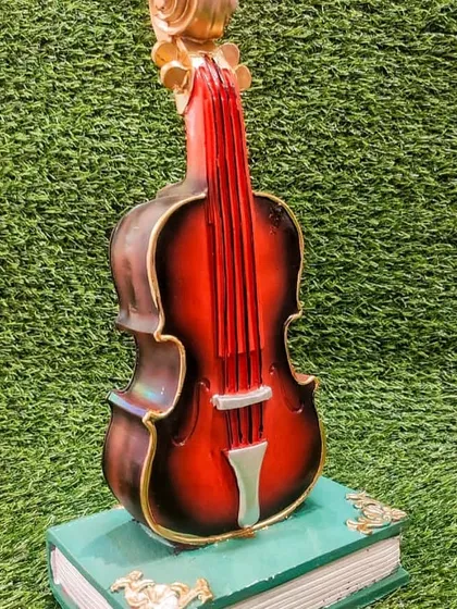 This is not just a showpiece, it's also a piggy bank. The violin design is perfect for music lovers to decorate their desks and save their change.