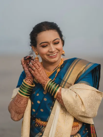 The joy of a bride on her wedding day. Her dewy, flawless base and happy smile are the highlights of this beautiful shot from her Dapoli wedding.