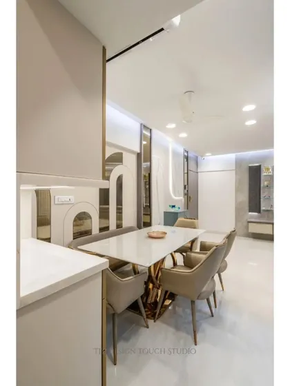 A closer look at the dining table and its connection to the custom cabinetry. This view highlights how we integrate storage and serving areas seamlessly into the dining experience.