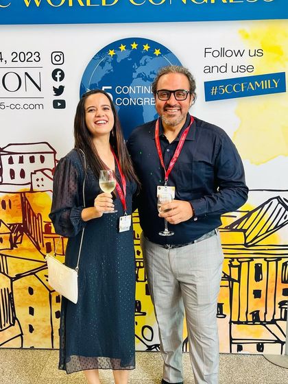 Celebrating a successful conference with a colleague at 5CC Lisbon. These events are a perfect blend of intensive learning and professional camaraderie.