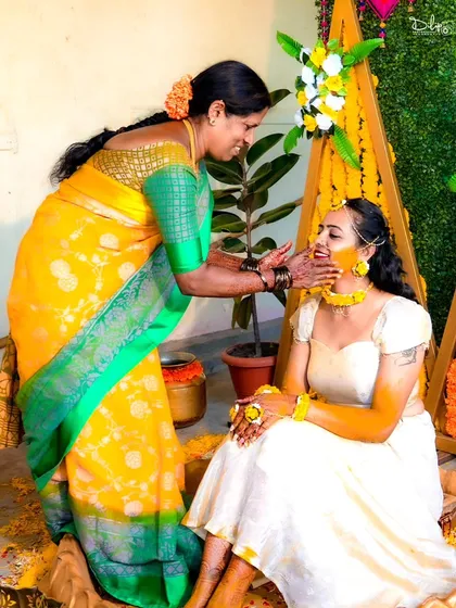 A heartwarming moment between the bride and her mother during the Haldi ceremony. Capturing these family interactions is an essential part of wedding photography.