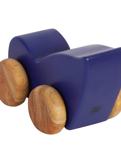 A bird-shaped wooden toy car, shot from an angle to show its design.