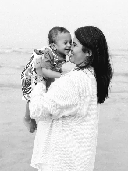 There's nothing more beautiful than the bond between a mother and her child. This black and white portrait from a beach session captures that pure, unscripted love.