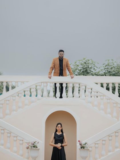 A creative, multi-level composition on a grand staircase set. This type of shot is visually interesting and adds a touch of drama.